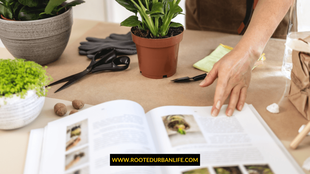 A gardener checking a gardening book laid open on a table