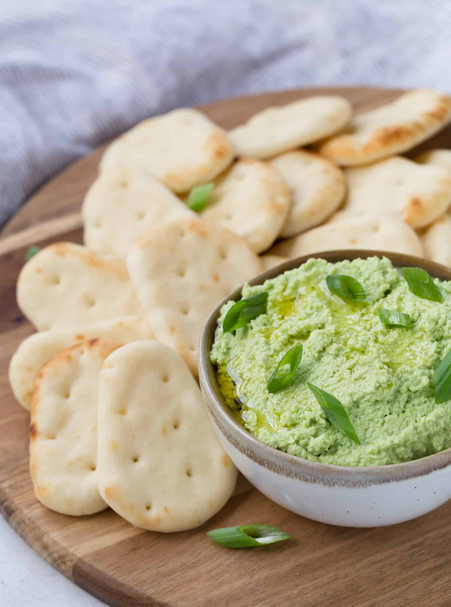 edamame-dip Edamame dip and crackers on a plate