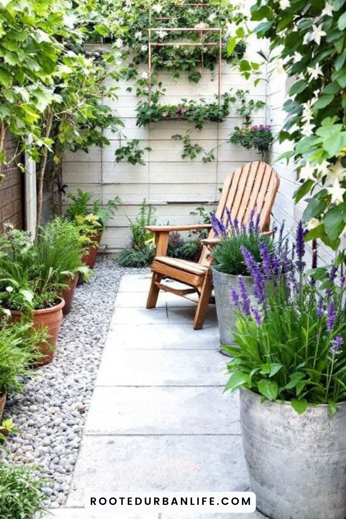 A chair on a small patio surrounded by plants